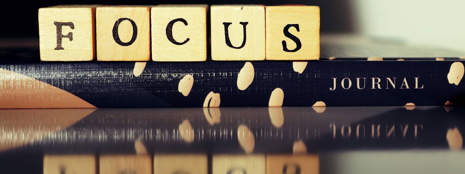 Scrabble tiles spelling out focus